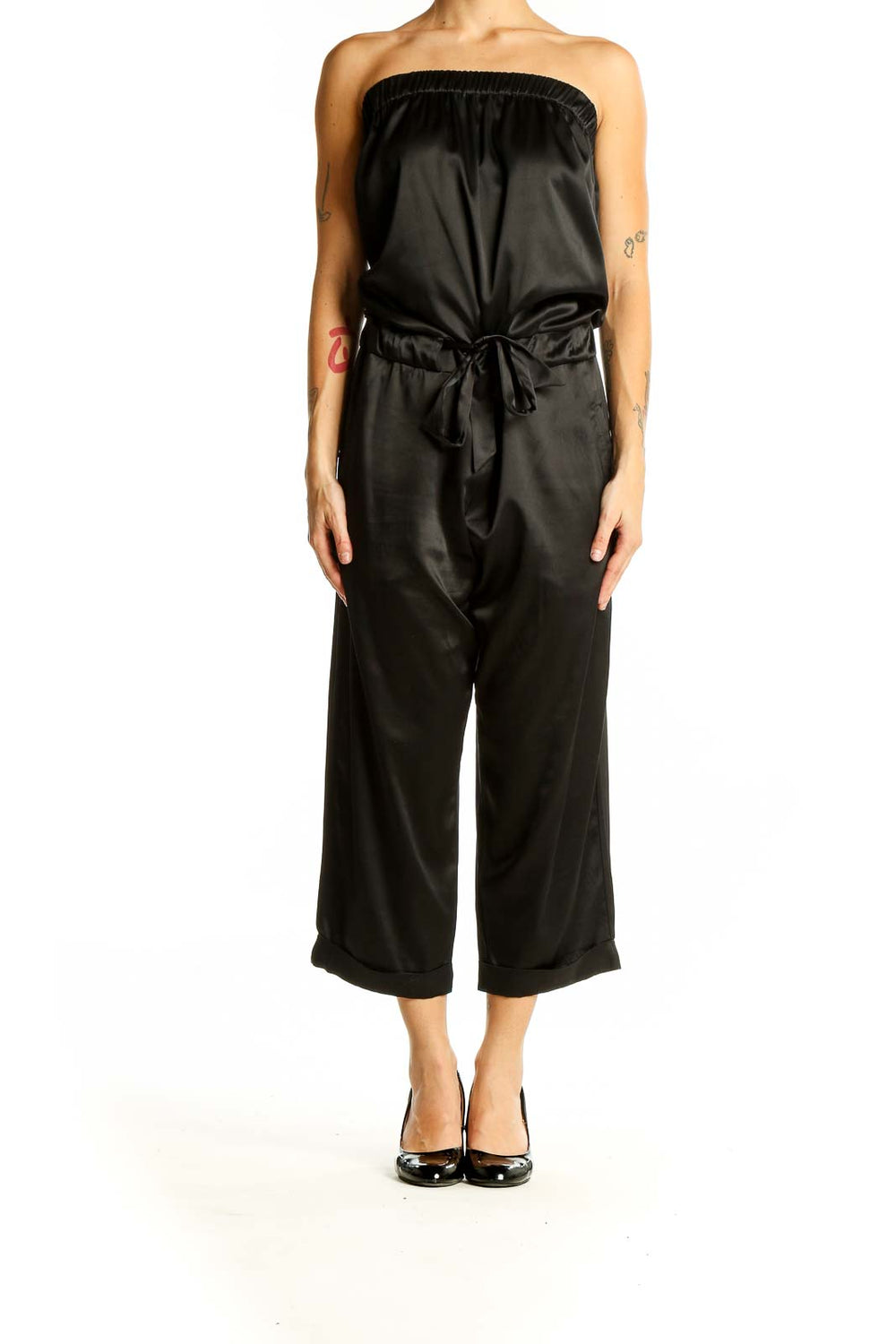 Front view of black strapless satin jumpsuit with tie waist