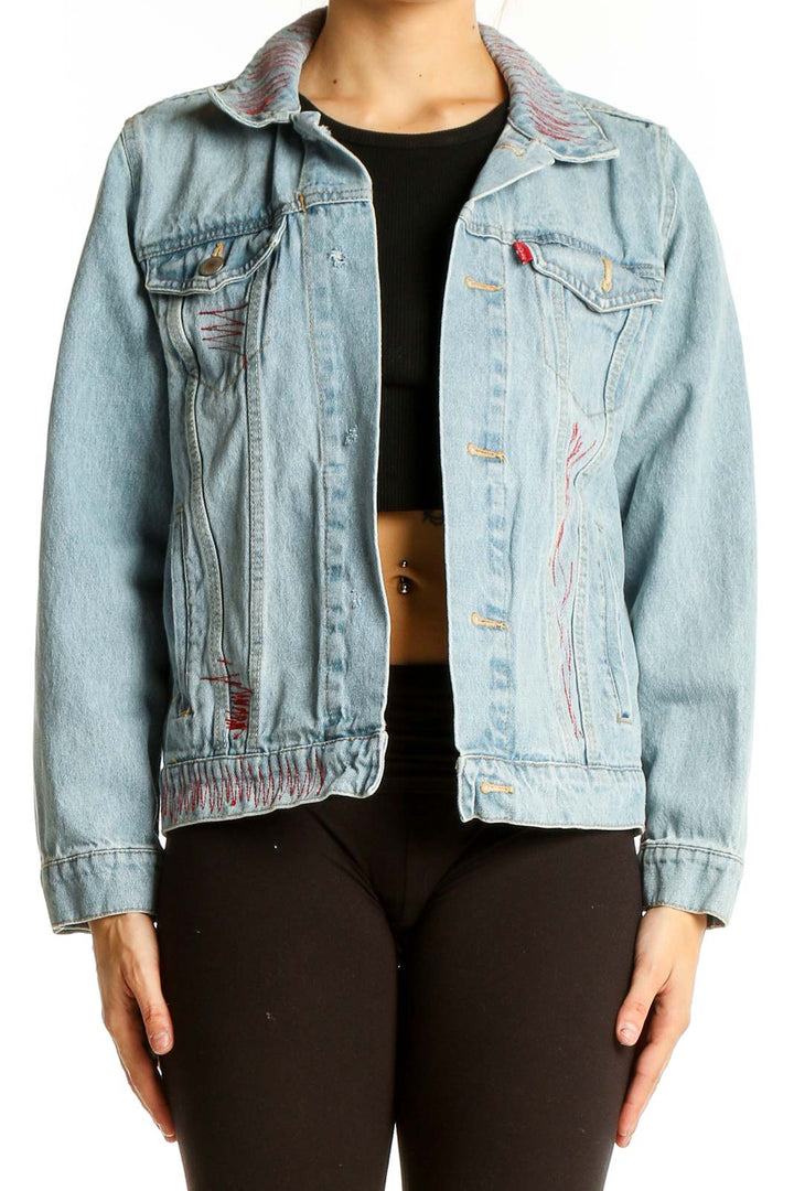 Front view of light blue Levi's denim jacket with pink embroidery