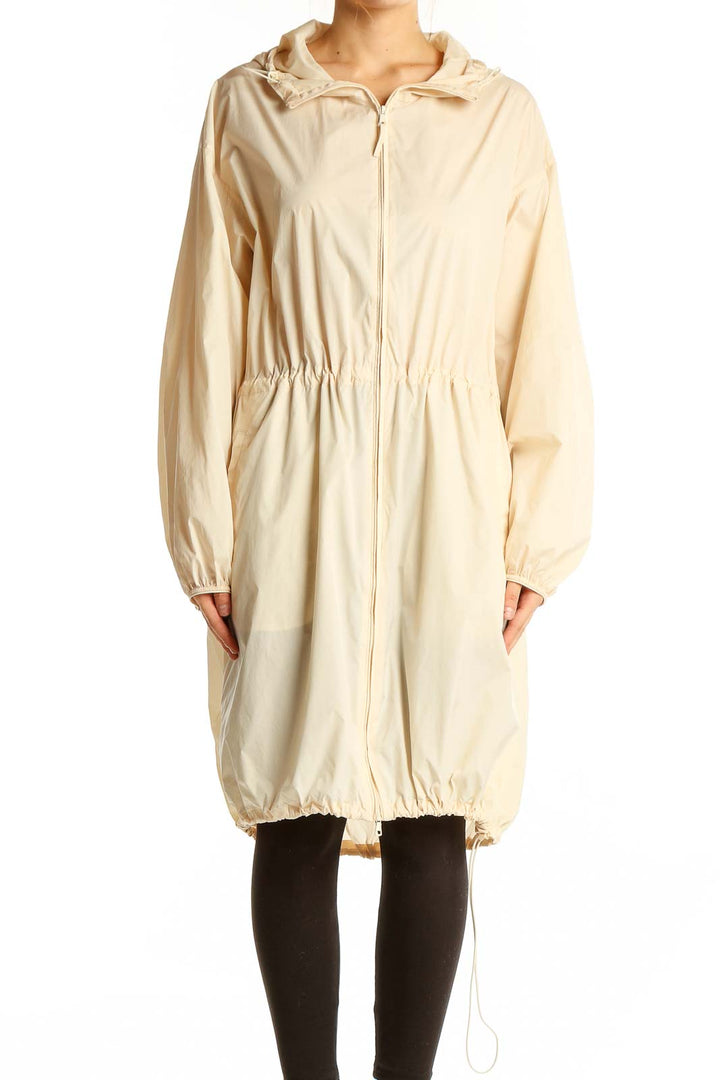 Front view of Uniqlo beige hooded parka jacket with drawstring waist