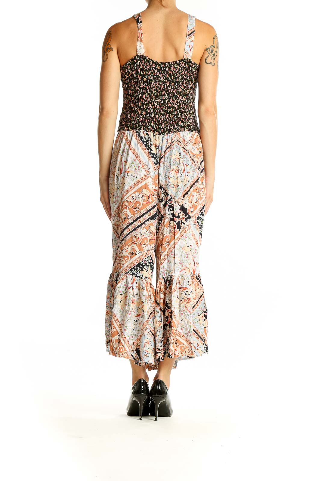 Back view of SilkRoll black floral jumpsuit showing wide-leg pants