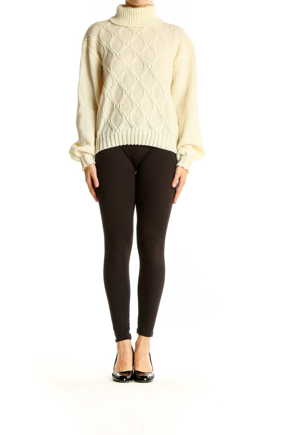 Front view of cream cable knit turtleneck sweater with diamond pattern