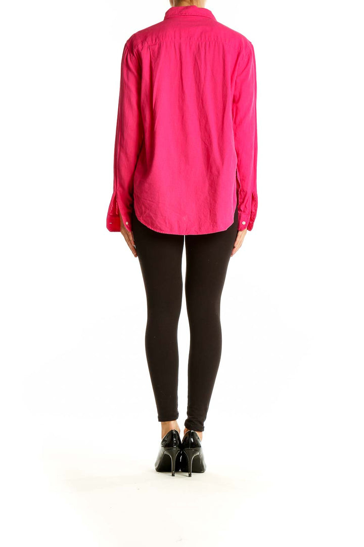 Back view of hot pink Ann Taylor LOFT button-down shirt on model