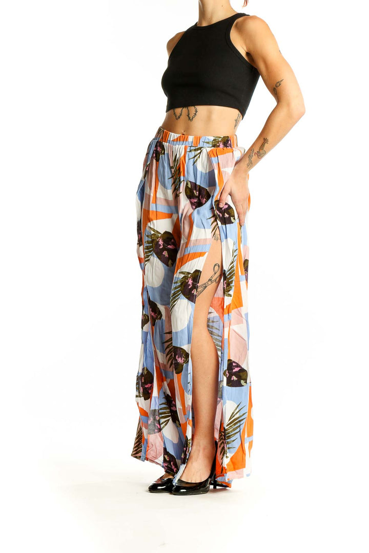 Front view of multicolor tropical print wide-leg pants by Thread Story