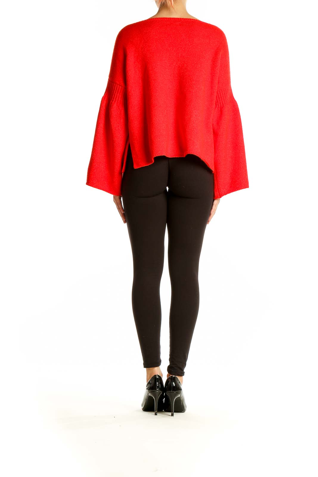 Back view of red bell sleeve knit sweater from Lou & Grey on model with black pants