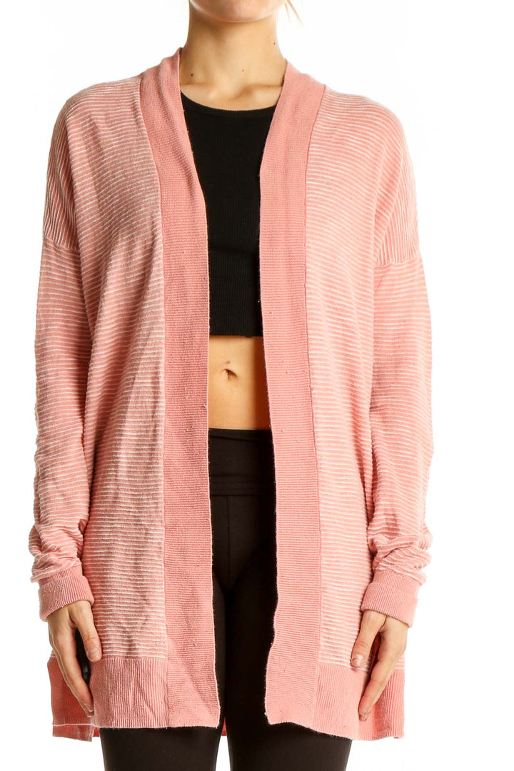 Front view of pink ribbed cotton open-front cardigan from Gap