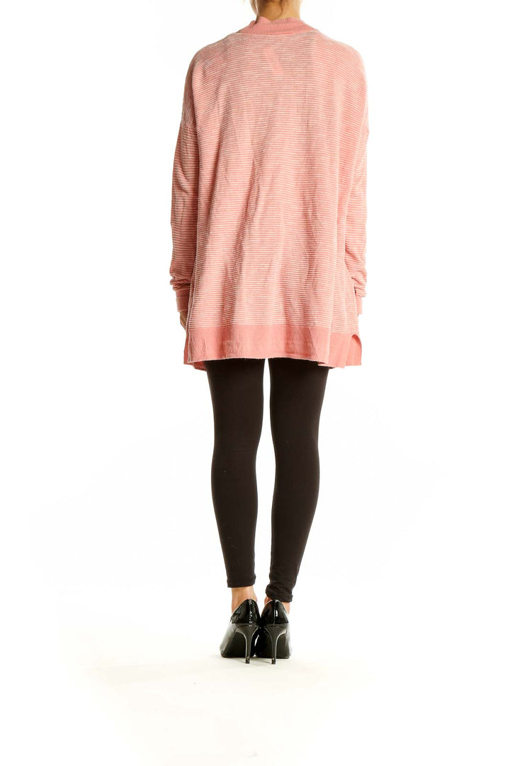 Back view of pink ribbed cotton open-front cardigan from Gap, shown on model