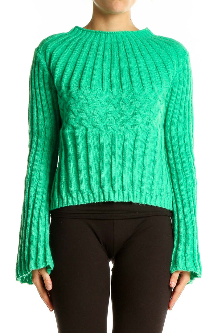 Front view of green ribbed cropped sweater with mock neck and bell sleeves