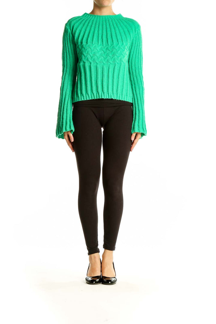 Front view of green ribbed cropped sweater with mock neck and bell sleeves