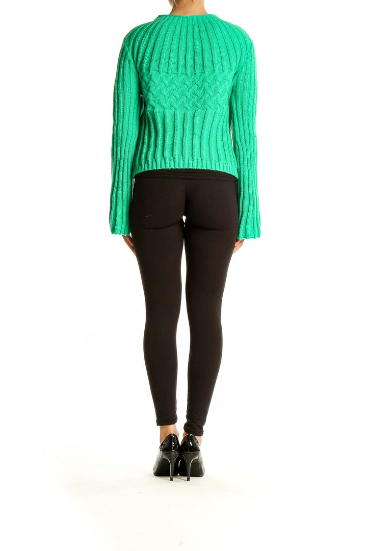 Back view of green ribbed cropped sweater showing full length and fit