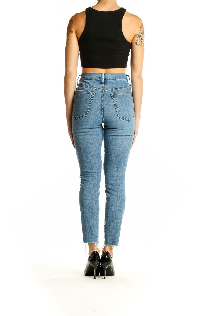 Back view of J.Crew light blue high-waisted jeans showing fit and pockets