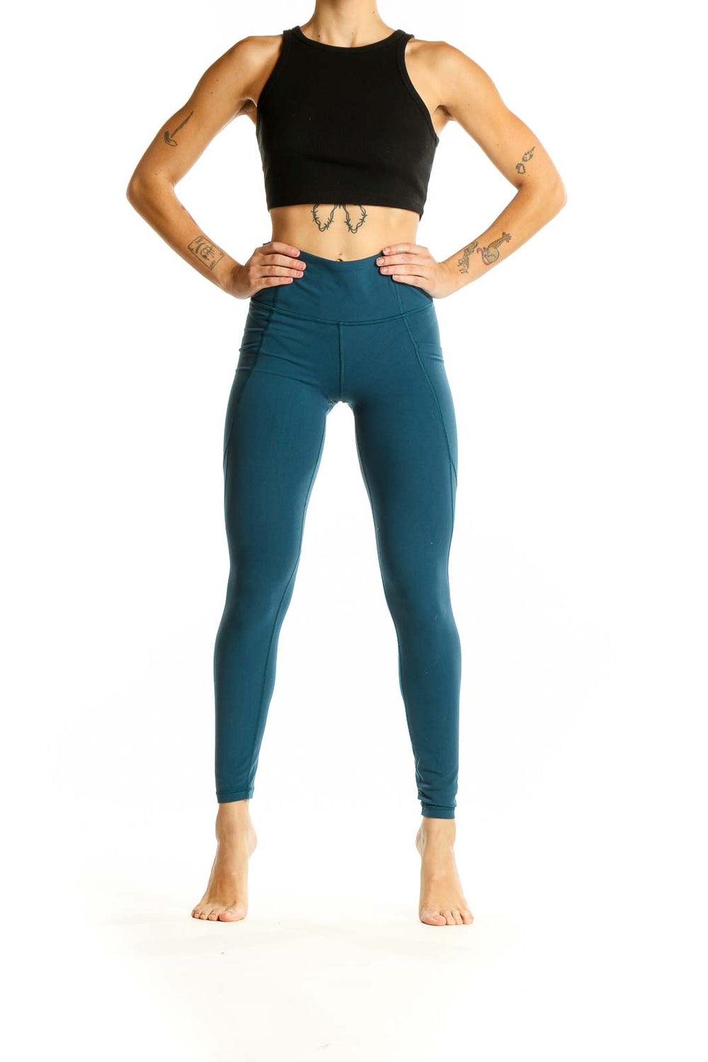 Front view of teal Athleta high-waisted performance leggings