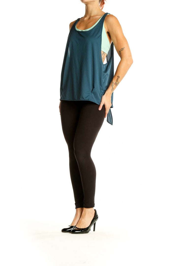 Front view of teal prAna activewear tank top with layered design