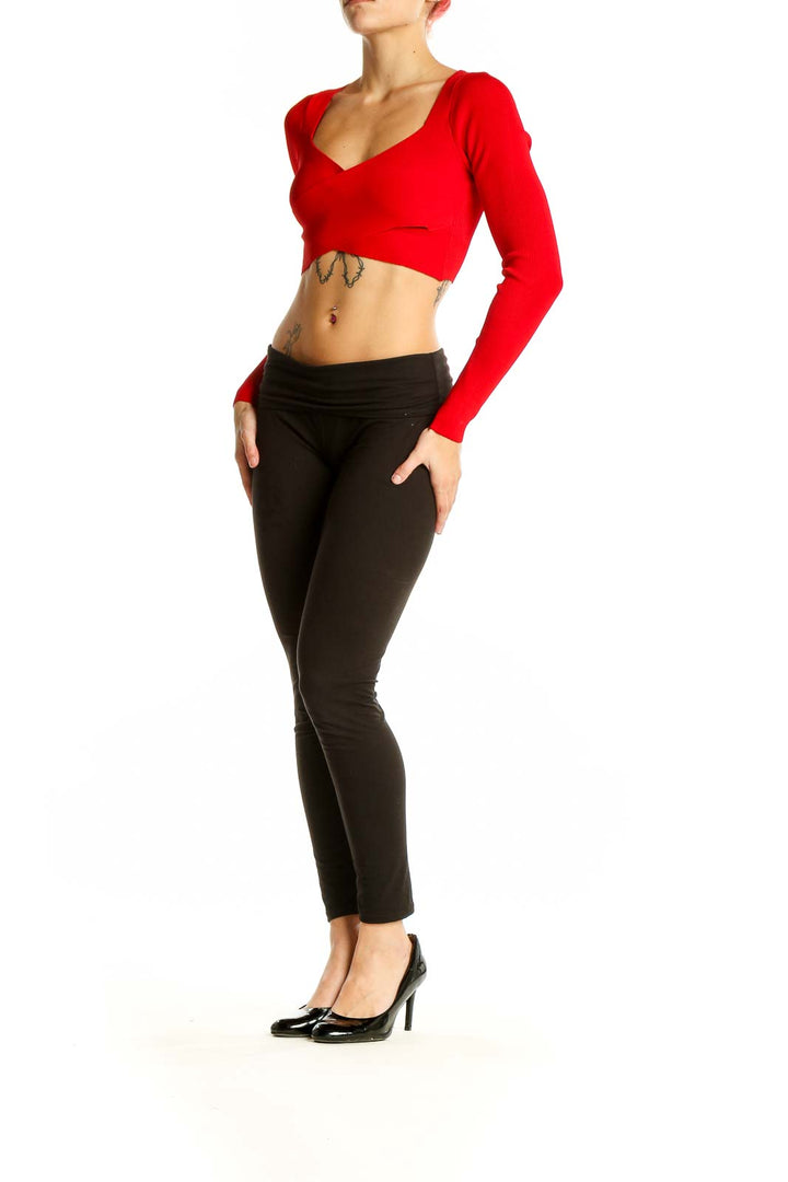 Front view of red cropped long sleeve sweater top from Express