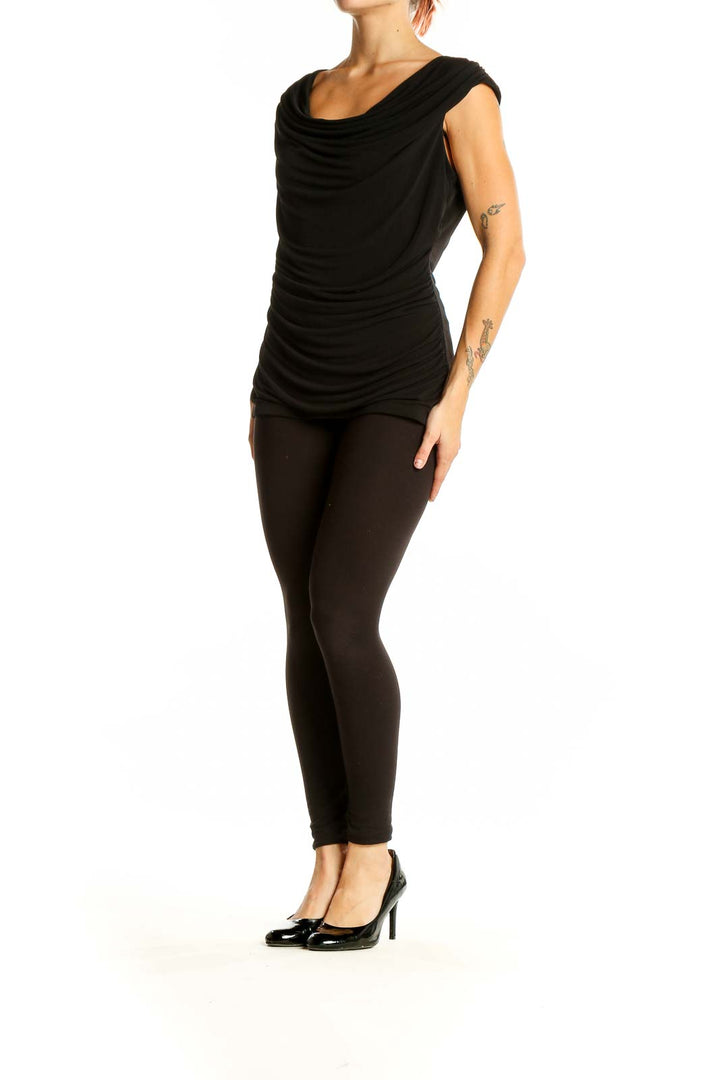 Front view of black sleeveless top with cowl neck and ruched sides