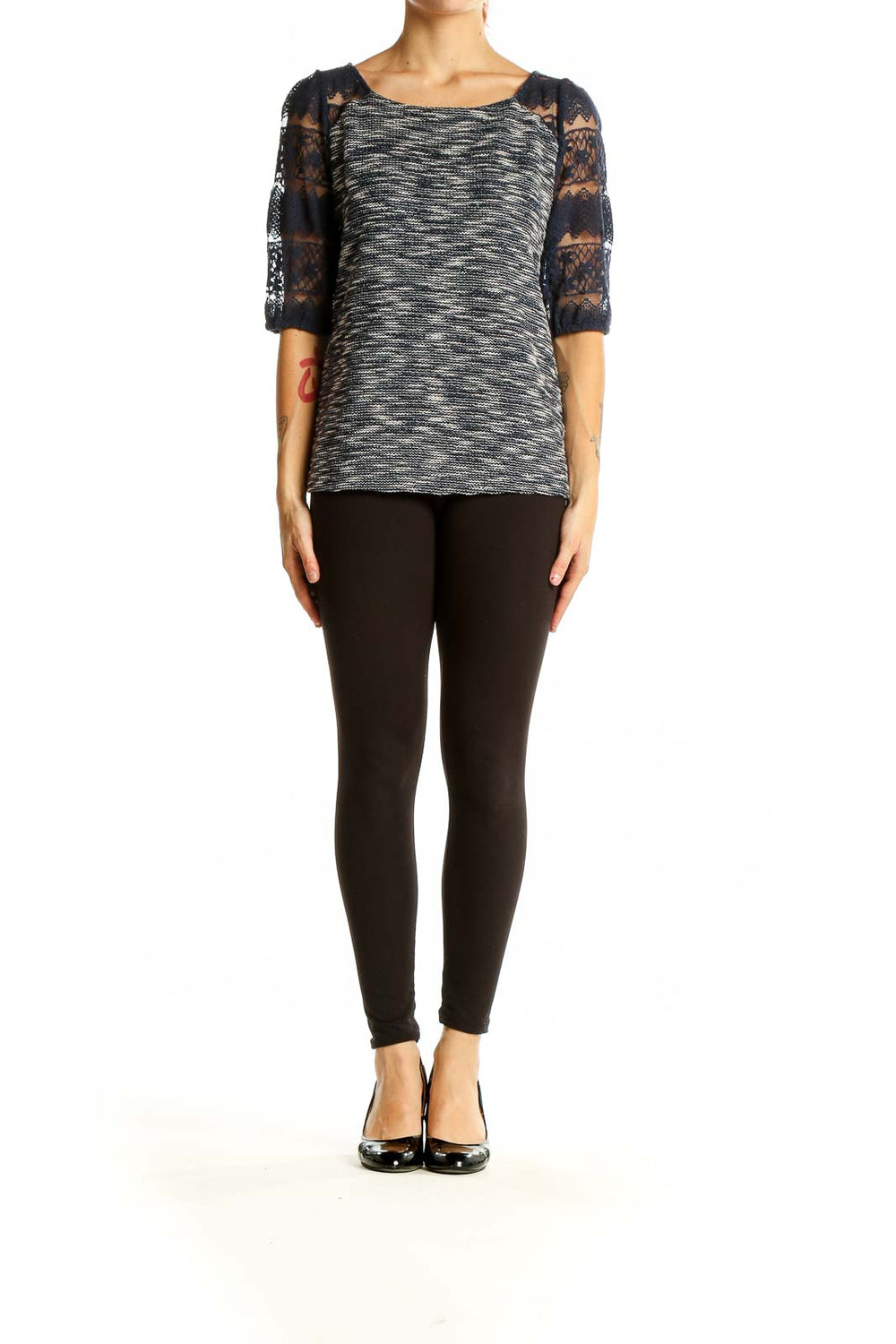 Front view of Anthropologie black and white marled top with navy lace sleeves