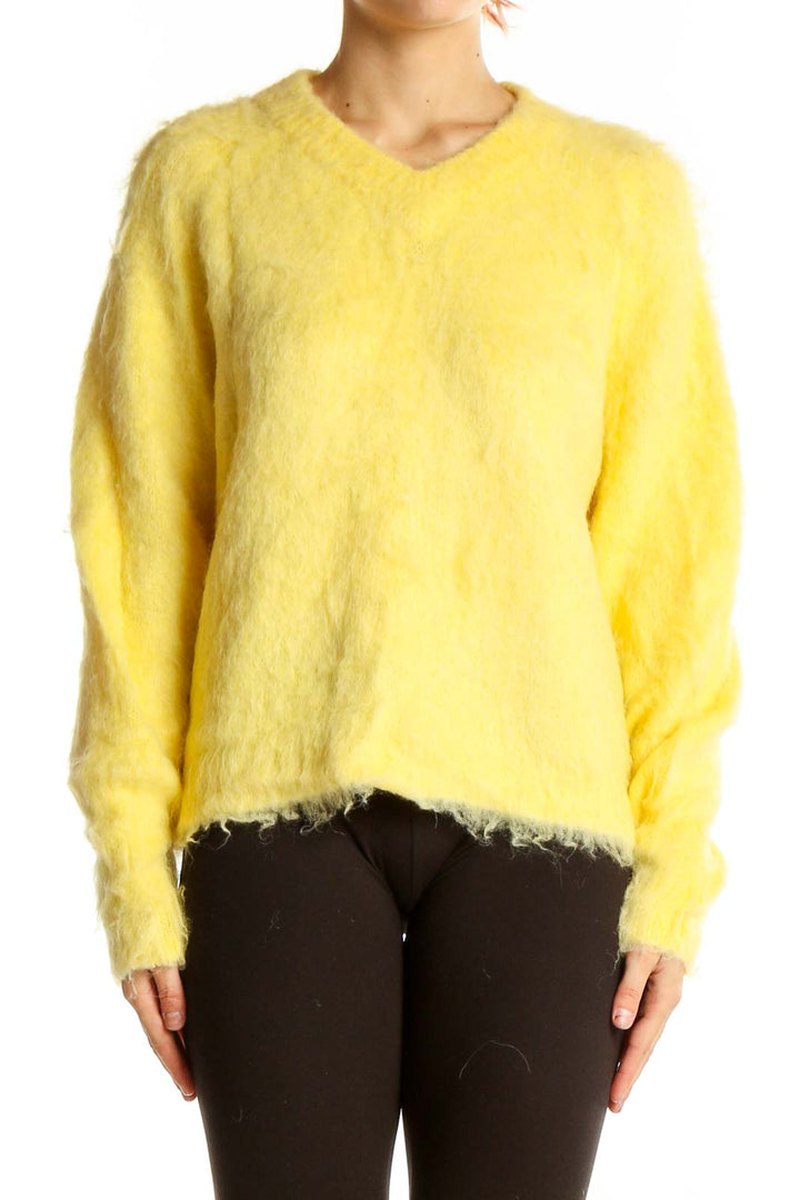 Front view of Madewell yellow fuzzy v-neck sweater on model