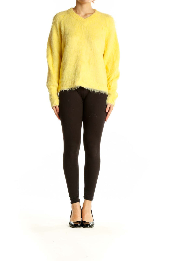 Front view of Madewell yellow fuzzy v-neck sweater on model