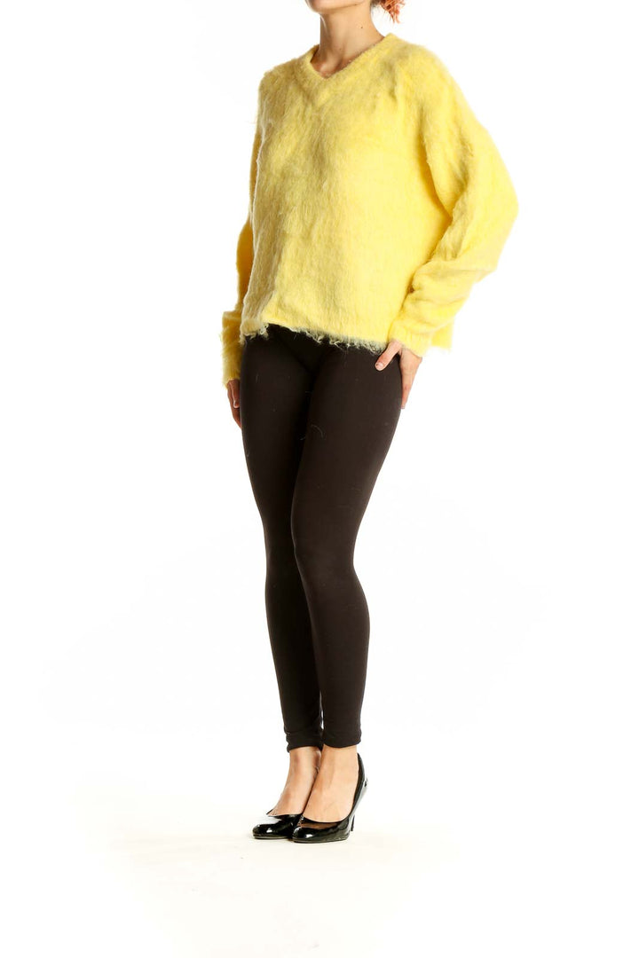 Front view of Madewell yellow fuzzy v-neck sweater on model