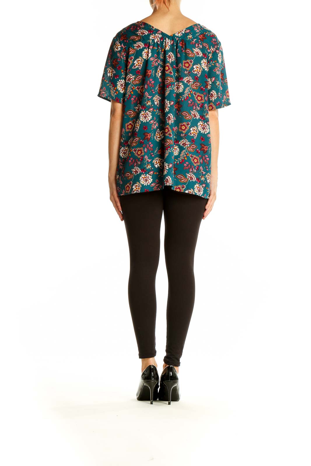 Back view of Pleione teal floral V-neck short sleeve blouse on model