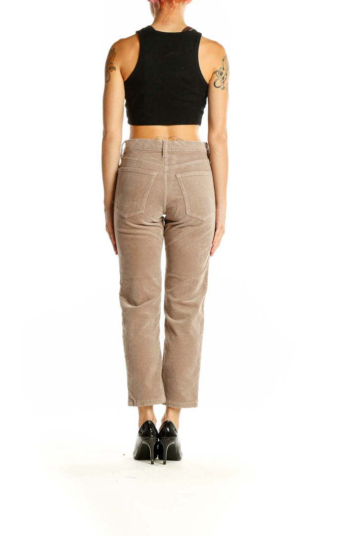 Side view of Banana Republic beige straight-leg pants on model with black top