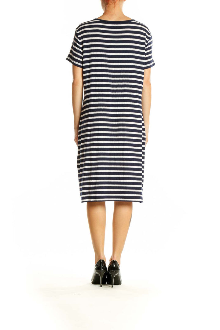 Side view of Brooks Brothers navy and white striped henley dress on model