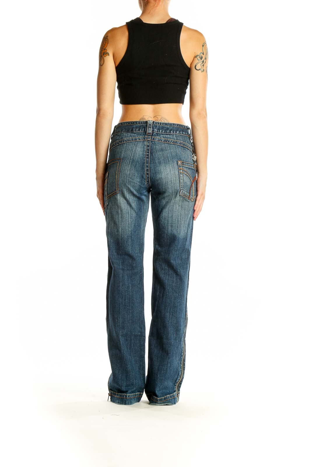 Back view of Rocawear blue distressed wide-leg jeans on model