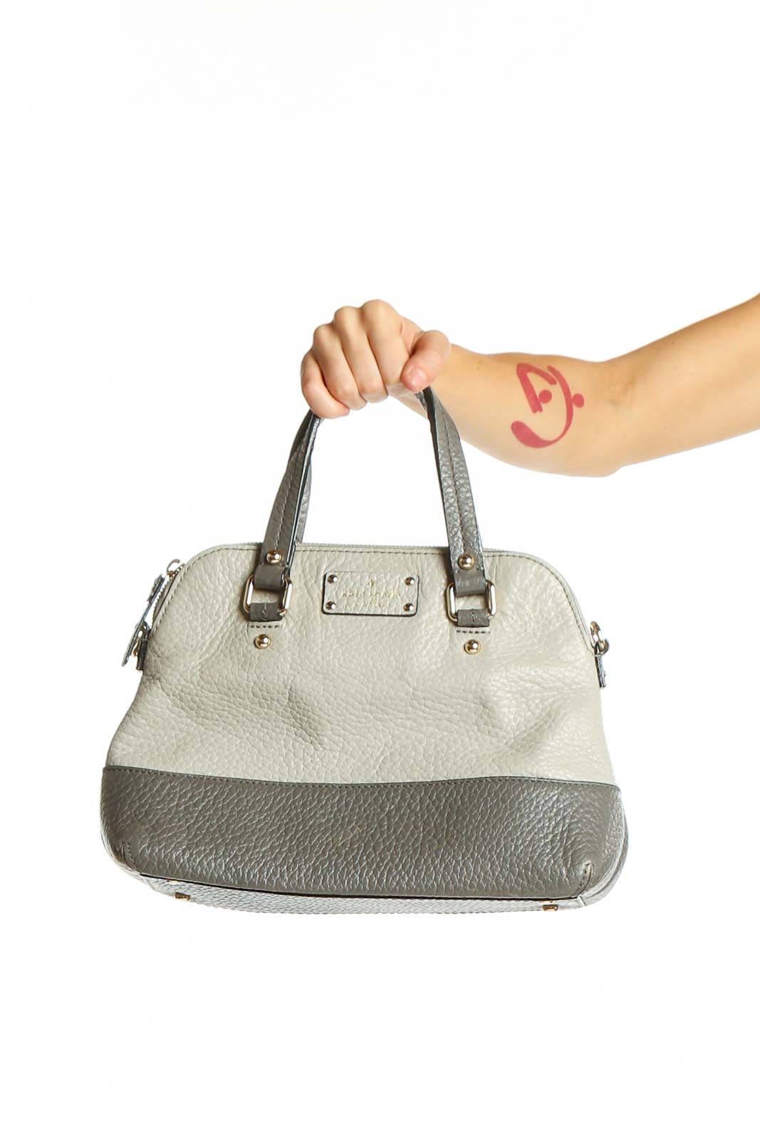 Front view of Kate Spade gray and white two-tone leather satchel