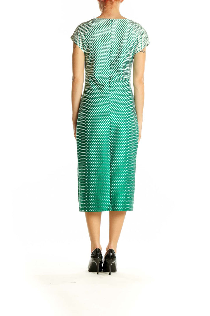 Side view of SAMI+DANI green ombre polka dot midi dress showing silhouette