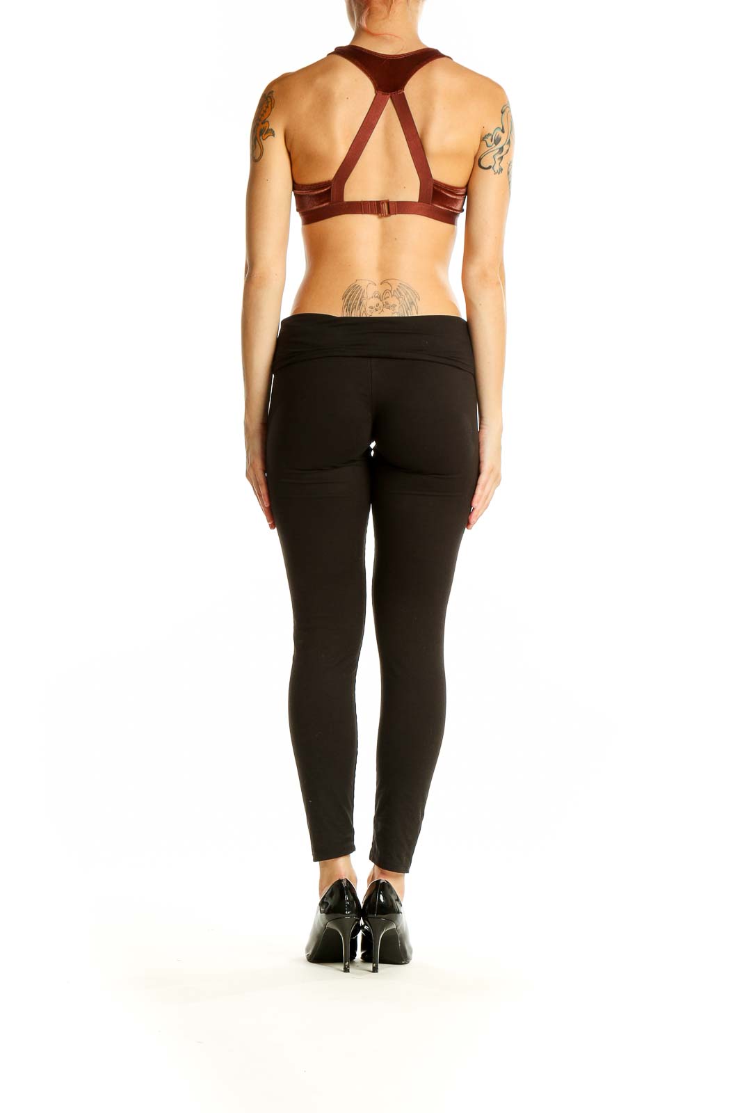 Side view of burgundy velvet Roxy crop top paired with black pants