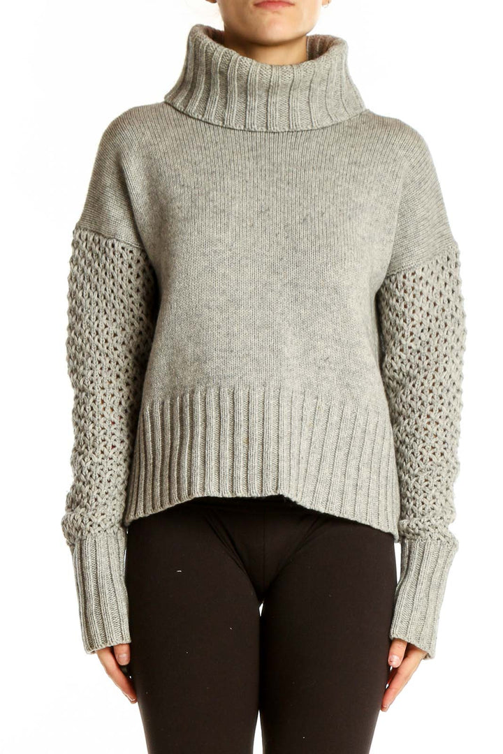 Front view of gray cashmere blend turtleneck sweater with ribbed collar and hem