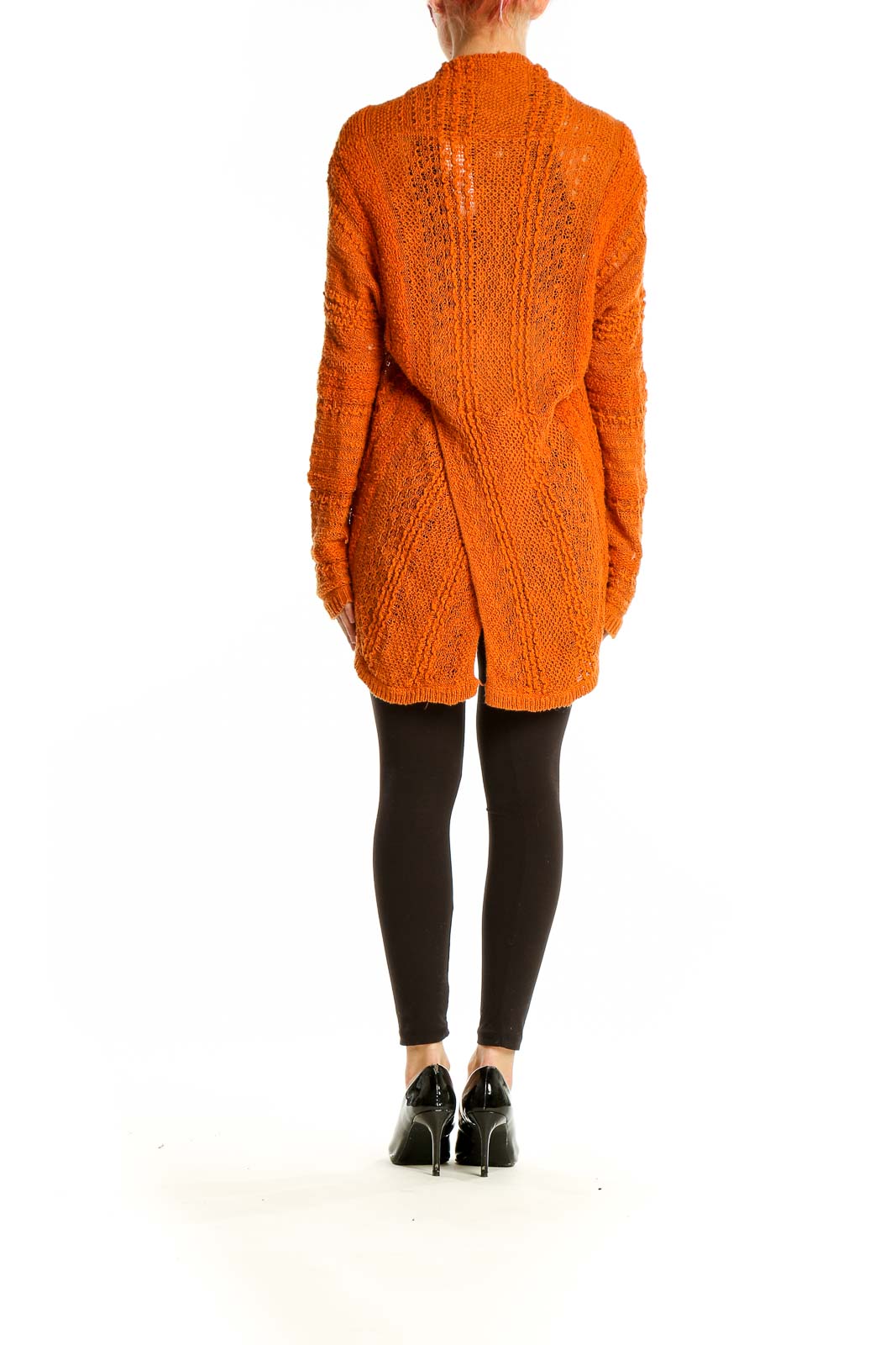 Side view of orange textured knit open cardigan by KNITTED & KNOTTED on model