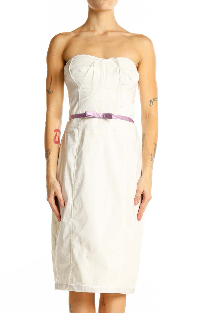 Front view of white strapless bodycon midi dress with lilac bow belt