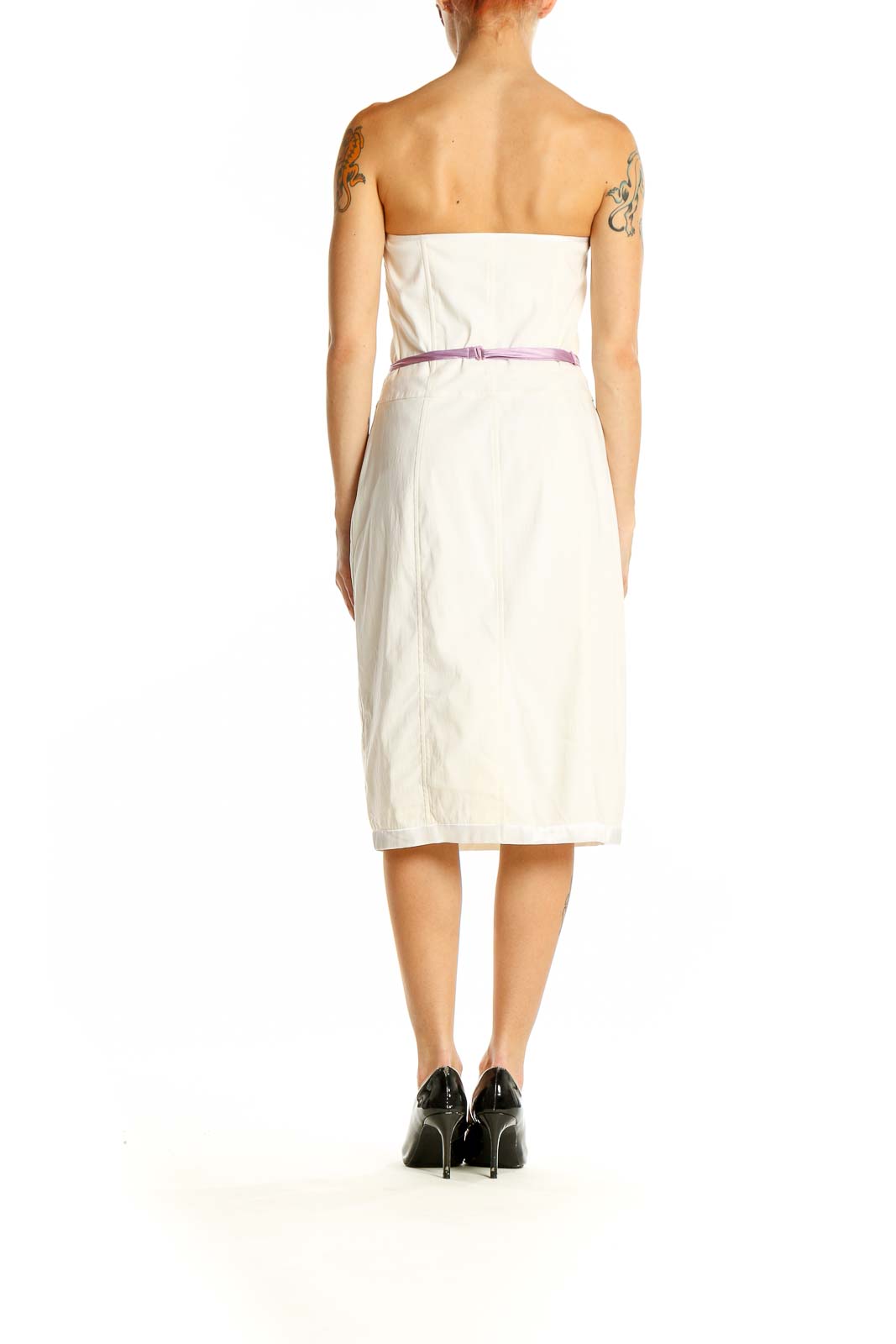 Side view of white strapless bodycon midi dress showing fitted silhouette