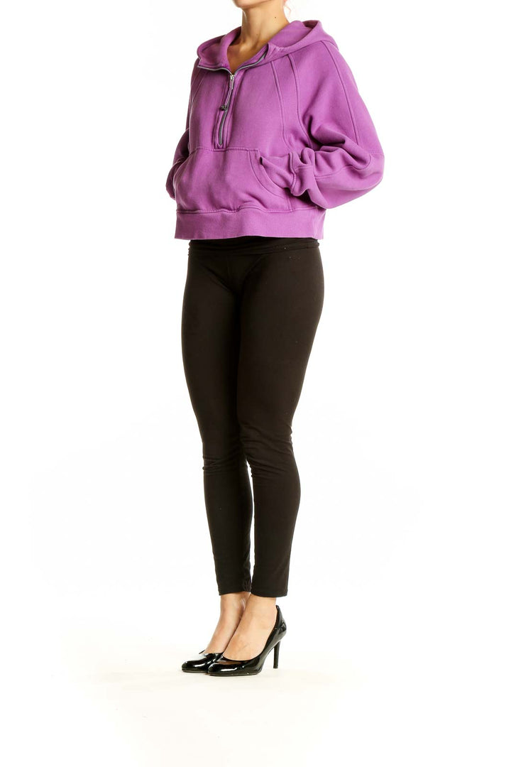 Front view of purple Lululemon cropped zip-up hoodie with hood and kangaroo pocket