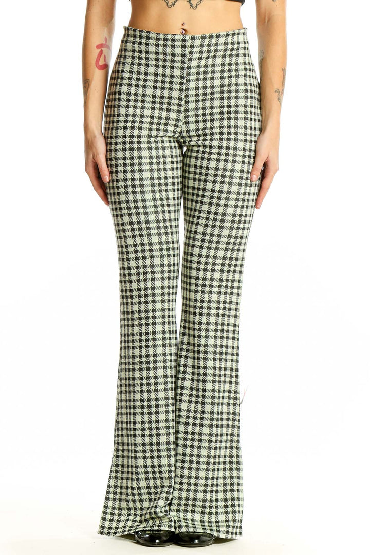 Front view of ASOS green gingham check flared pants on model