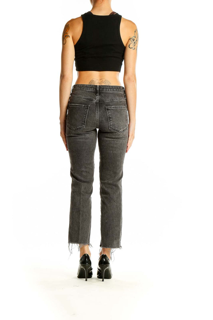 Back view of Free People charcoal gray cropped straight-leg jeans on model