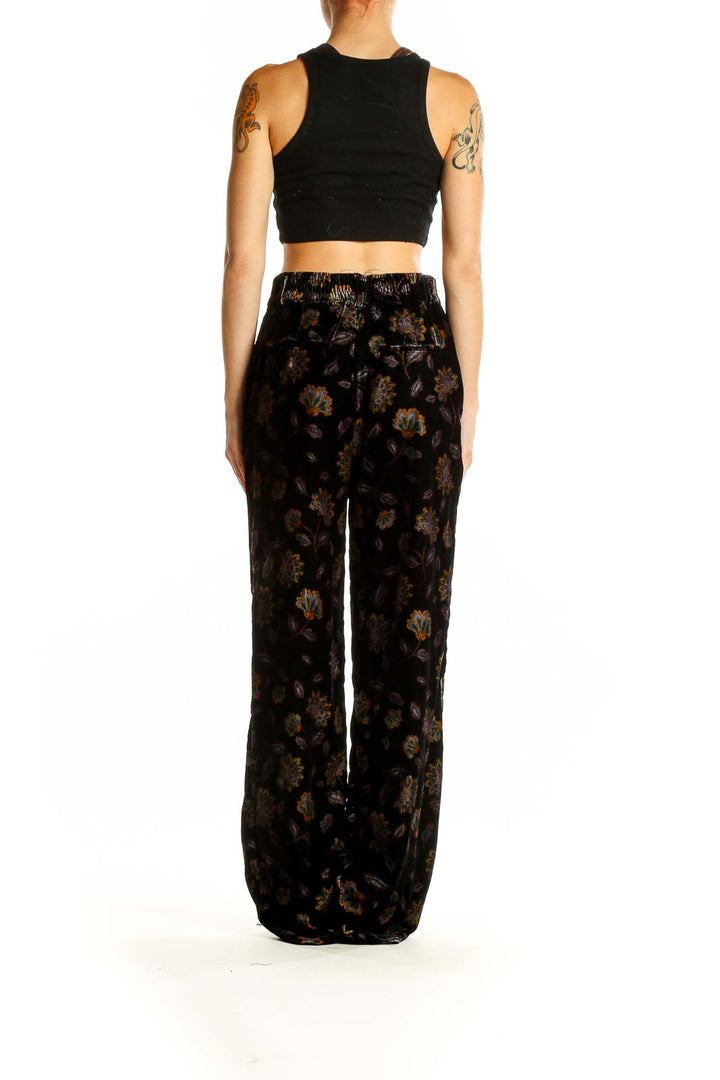 Side view of Rachel Zoe black velvet wide-leg pants showing silhouette