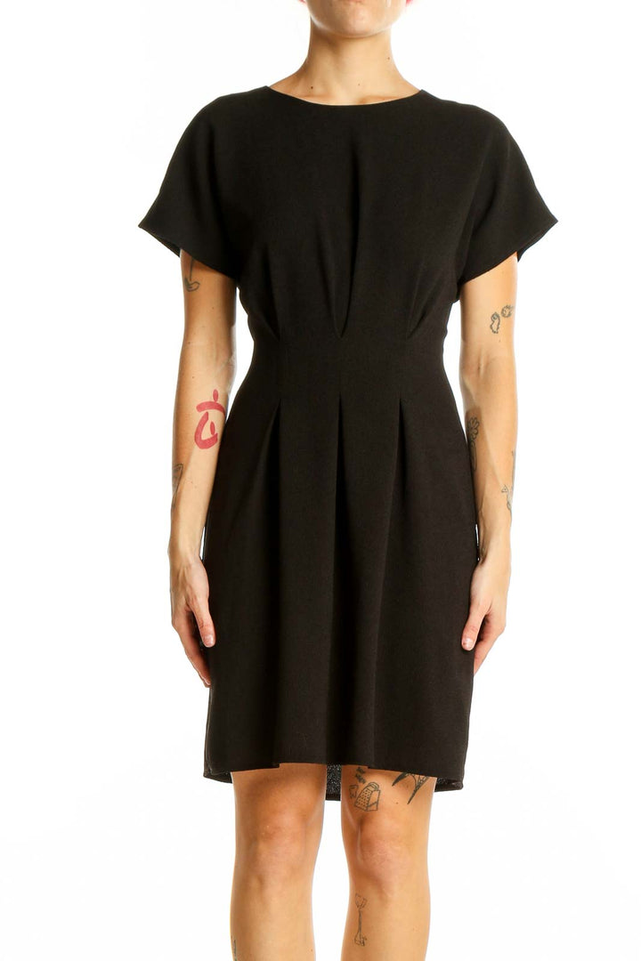 Front view of black ASOS mini dress with pleated waist and short sleeves