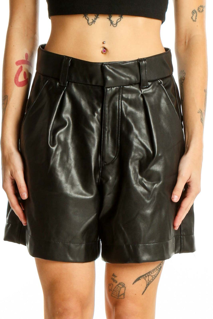 Front view of Abercrombie & Fitch black faux leather high-waisted pleated shorts