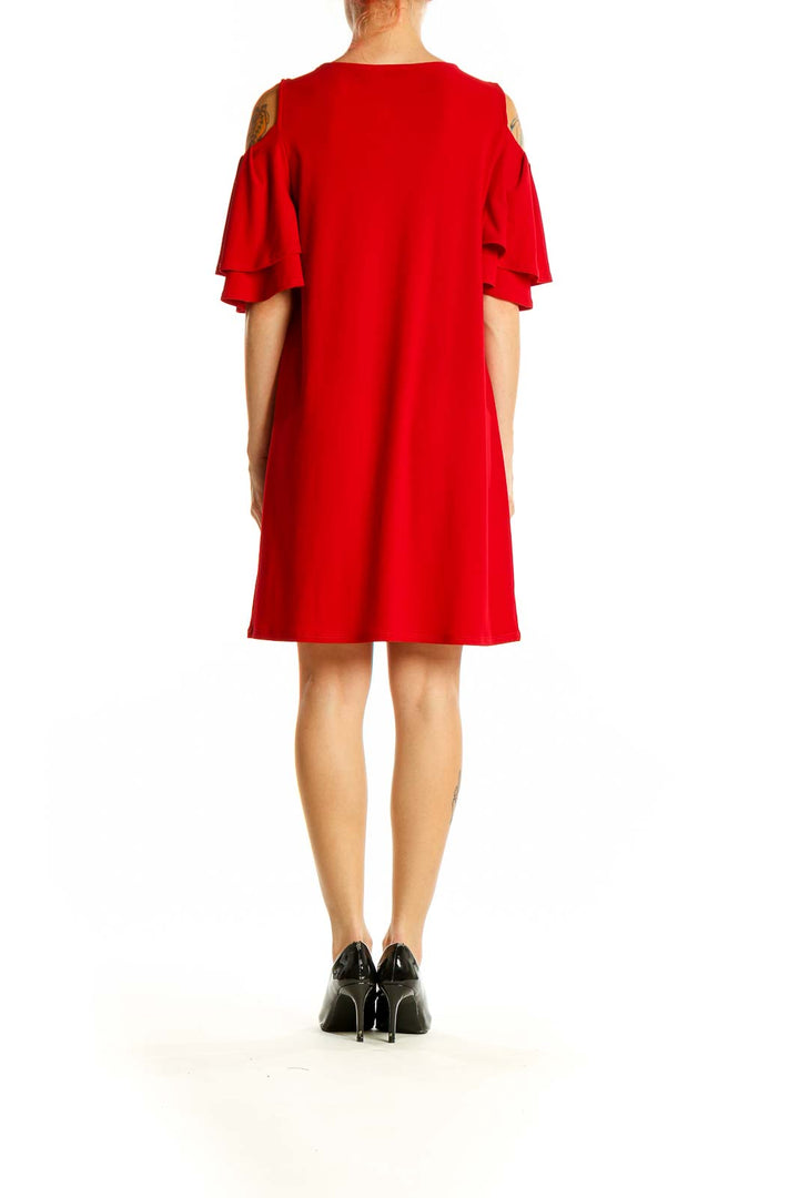 Side view of red Halogen cold shoulder dress showing ruffle sleeve detail