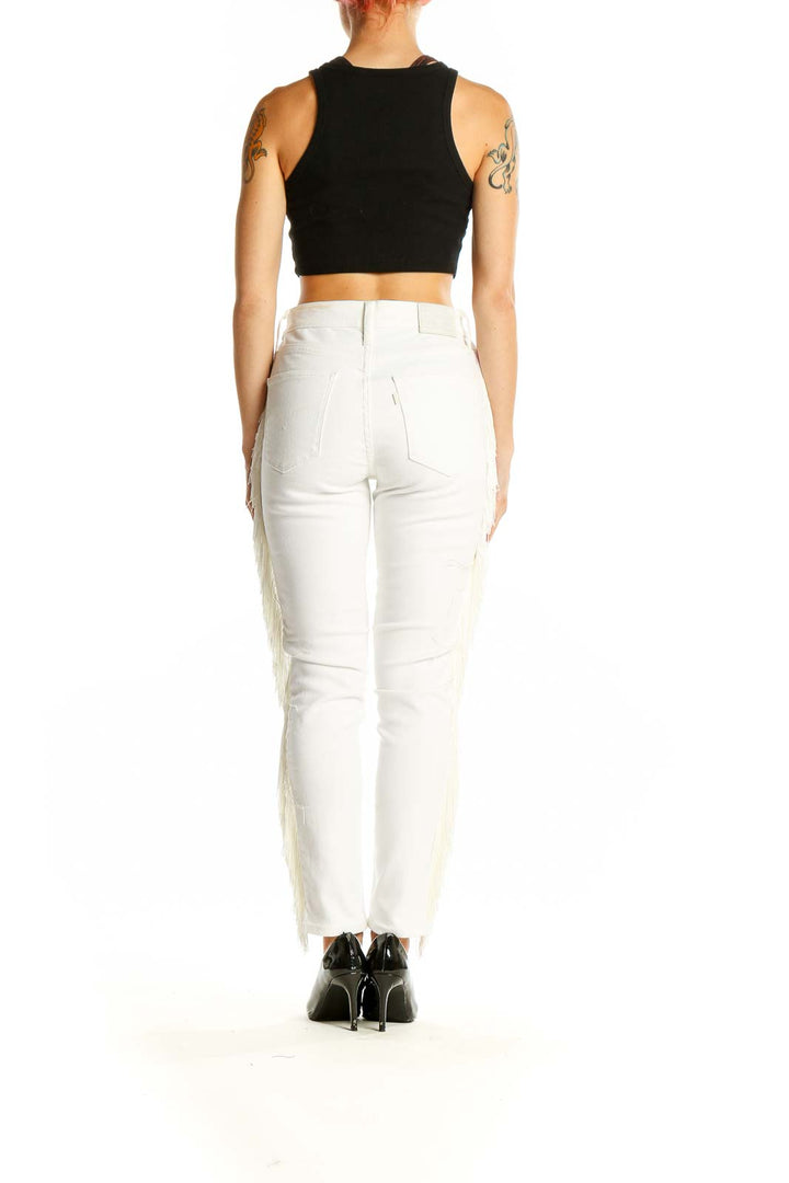 Side view of Levi's white straight leg jeans showcasing fringe along outer seam