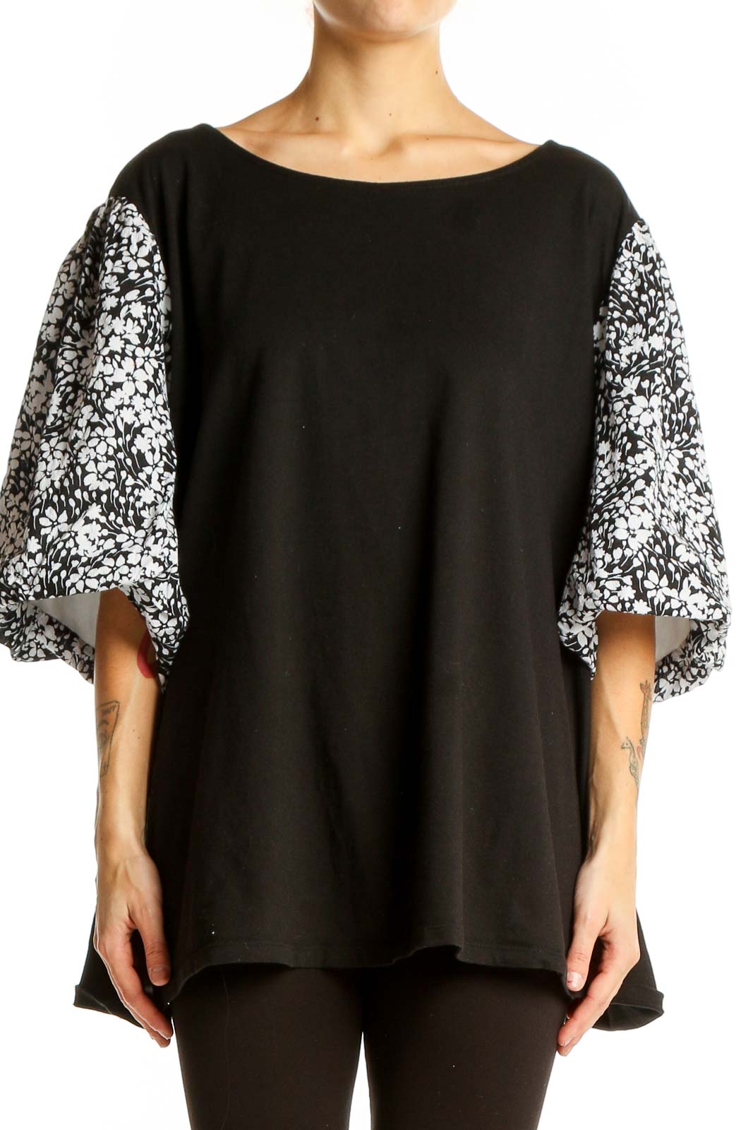 Front view of Talbots black top with floral print balloon sleeves