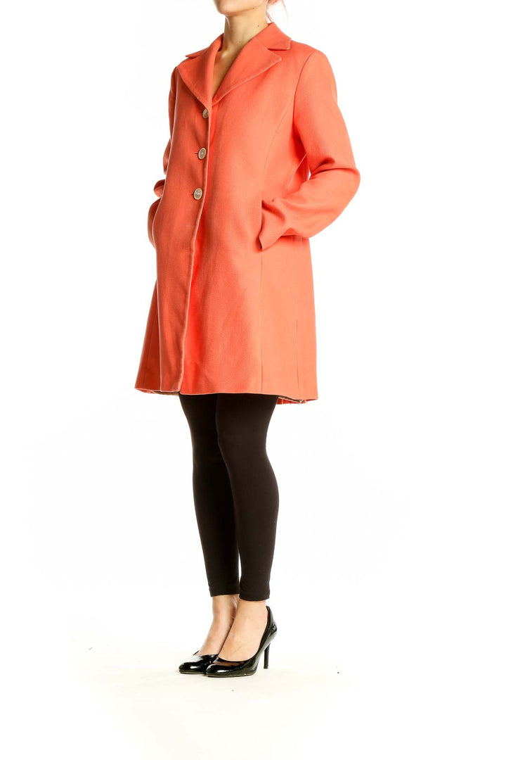 Front view of coral Ann Taylor button-front coat on model