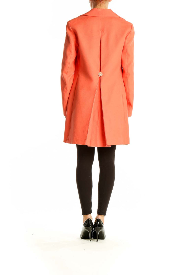 Back view of coral Ann Taylor button-front coat on model