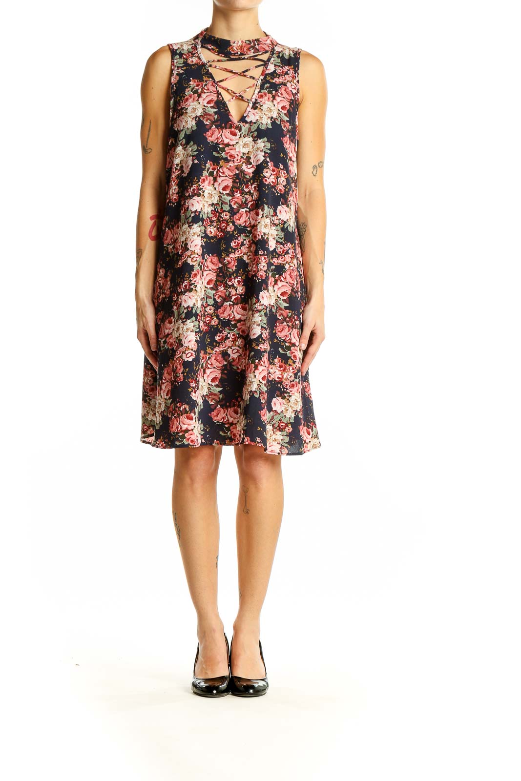 Front view of Altar'd State navy floral dress with lace-up neckline