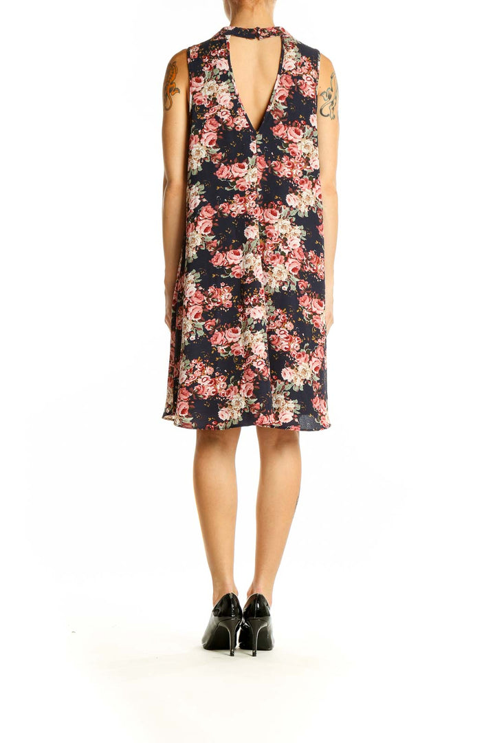 Side view of Altar'd State navy floral dress showing A-line silhouette