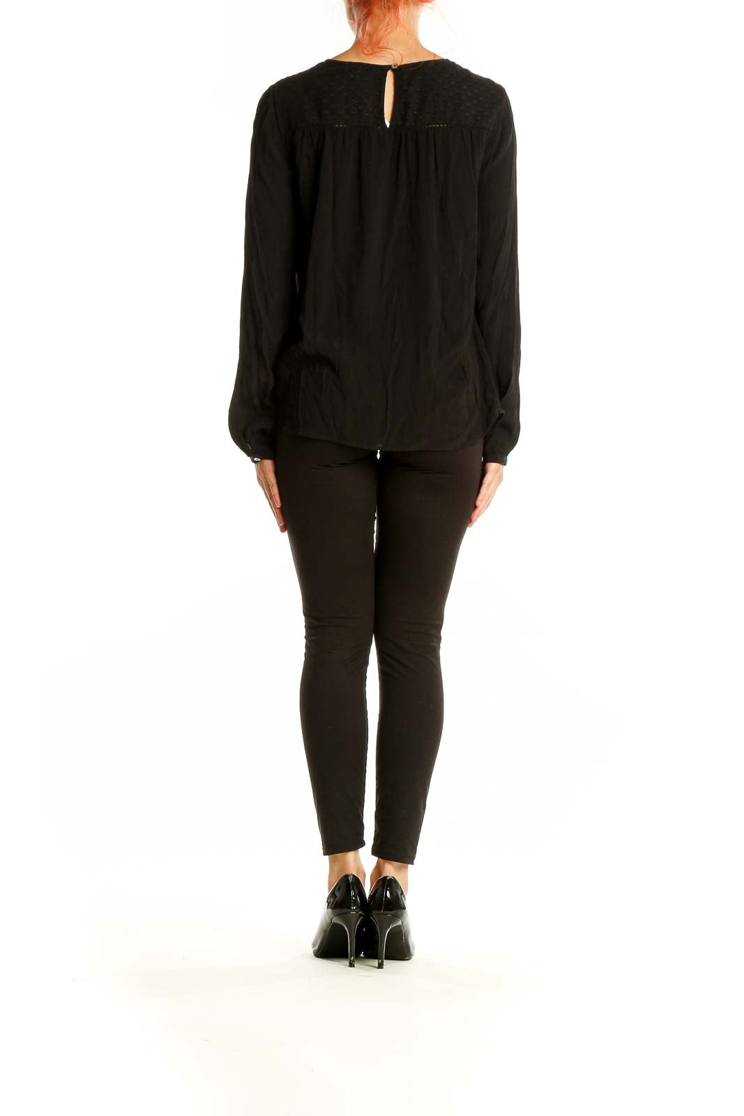 Side view of Meadow Rue black rayon blouse showing flowing silhouette