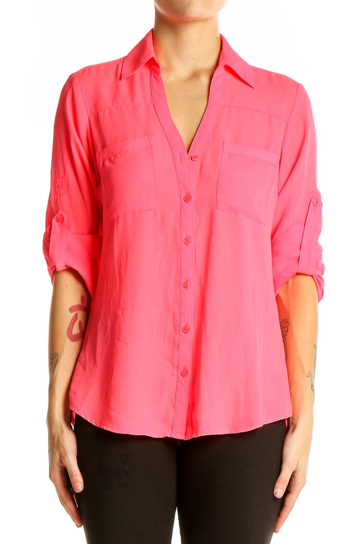 Front view of pink Express button-down blouse with chest pockets