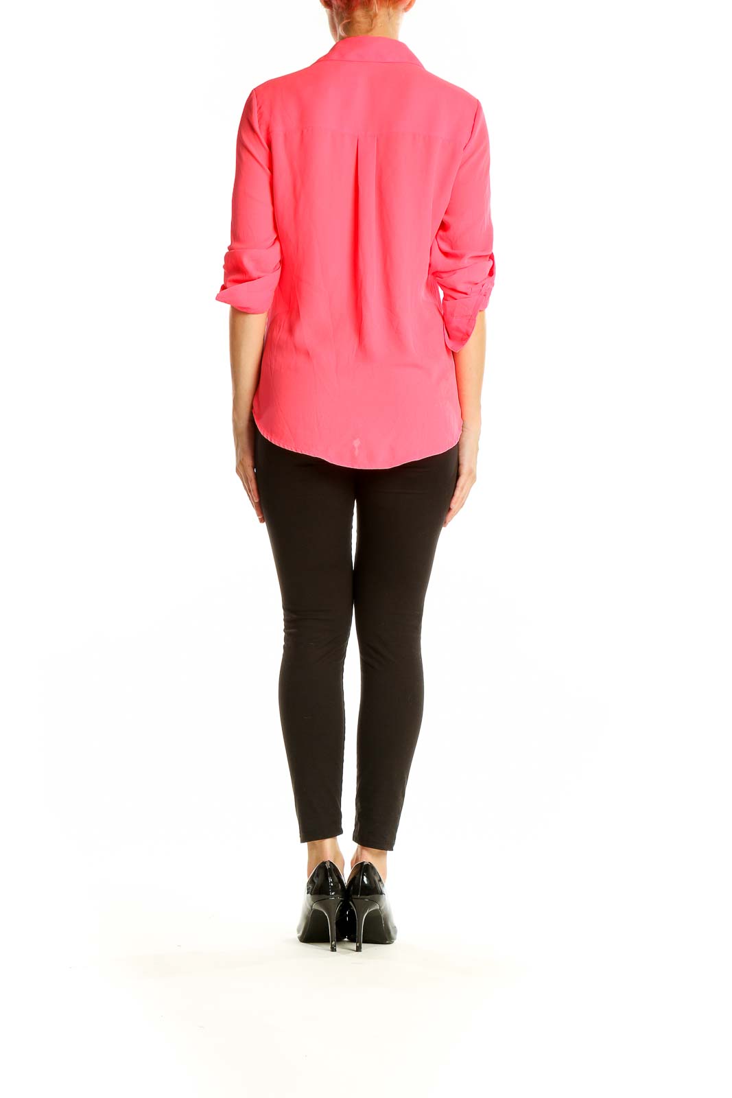 Side view of pink Express blouse on model with black pants