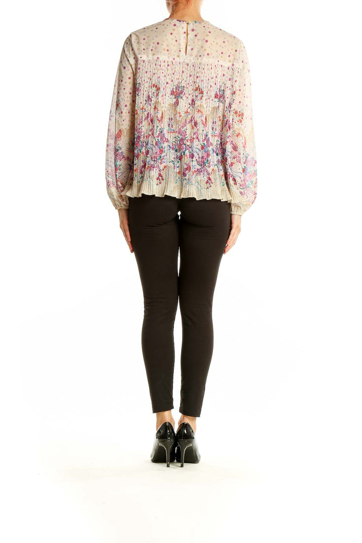 Back view of SilkRoll beige floral pleated long sleeve blouse showing full pattern